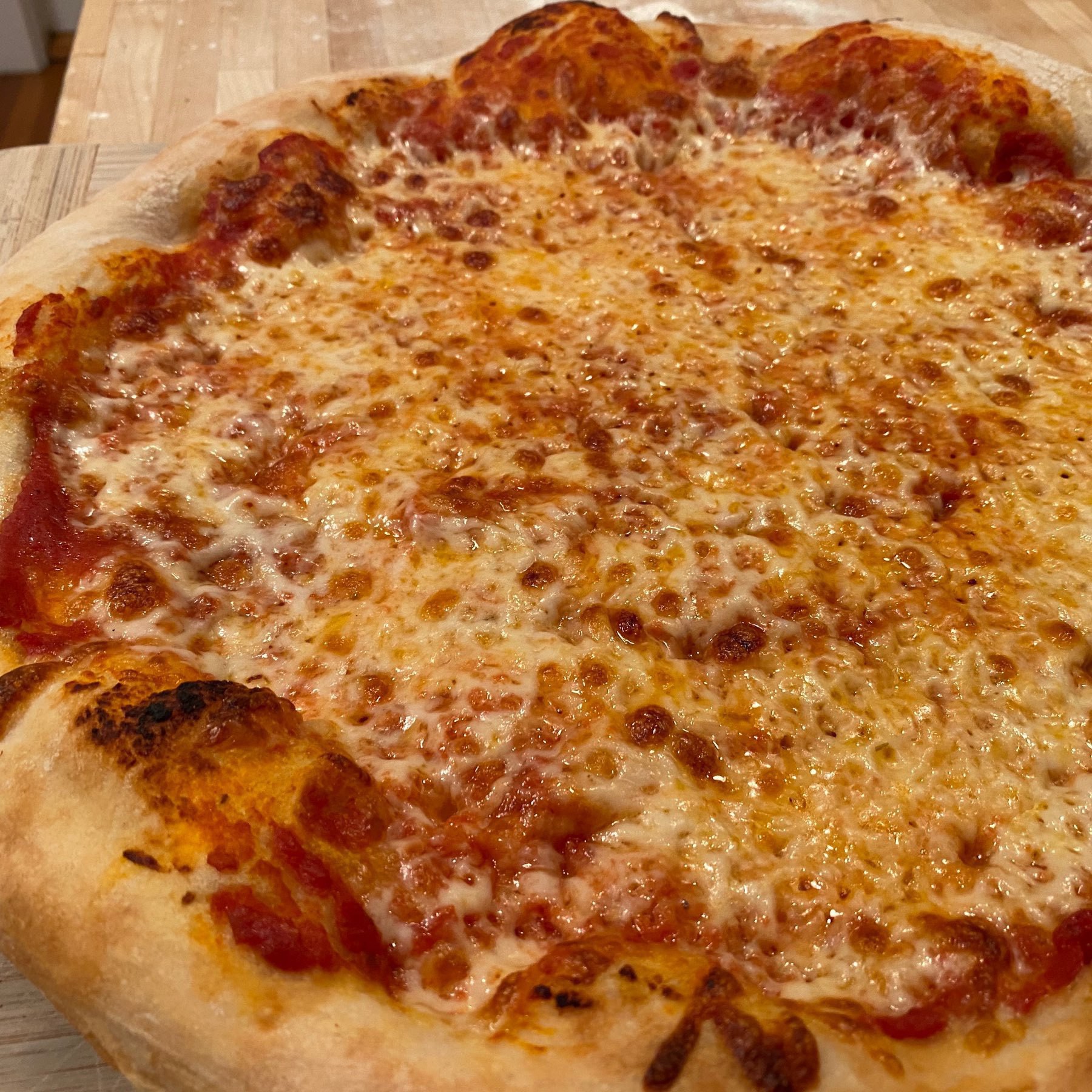 large homemade cheese pizza