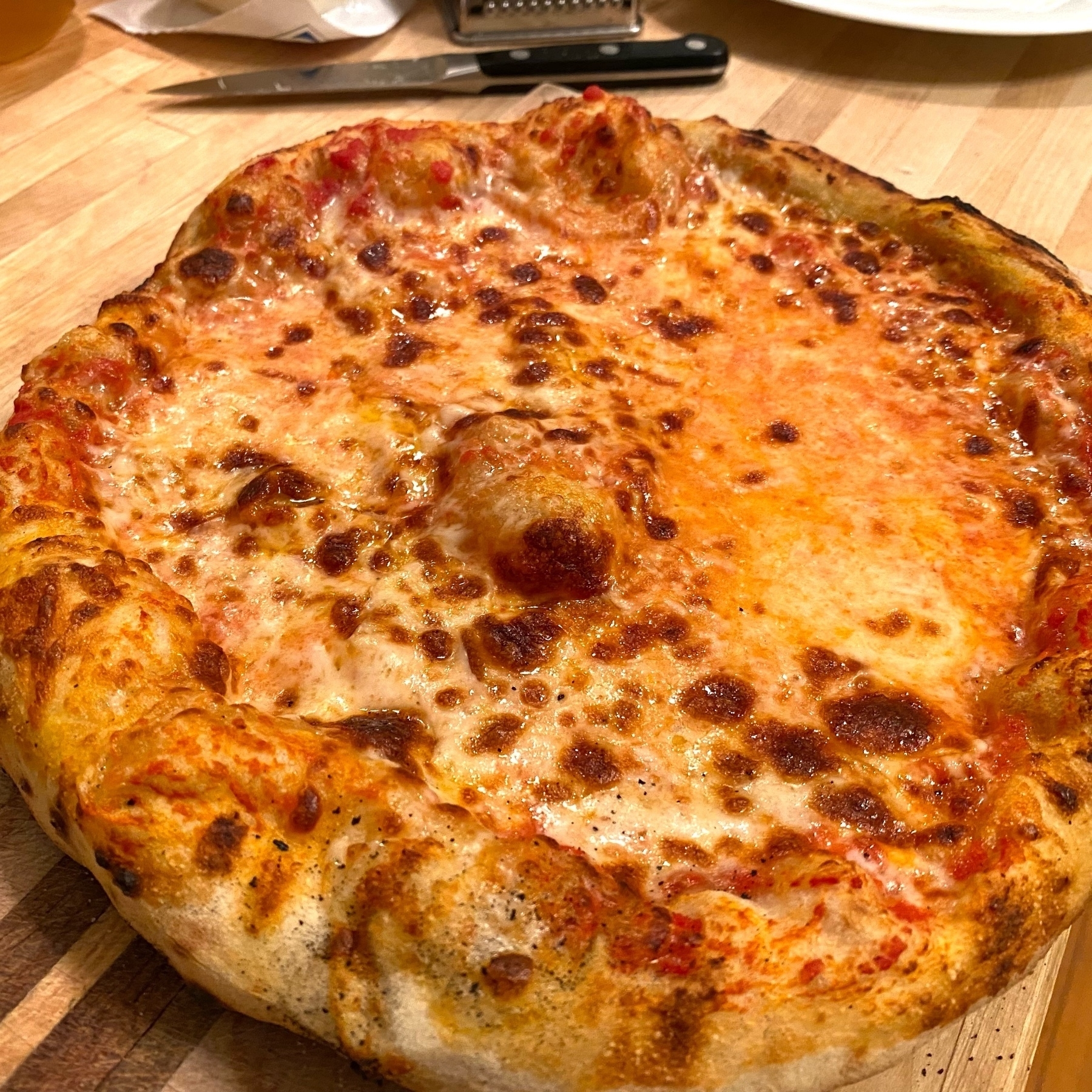 homemade cheese pizza with bubbly crust