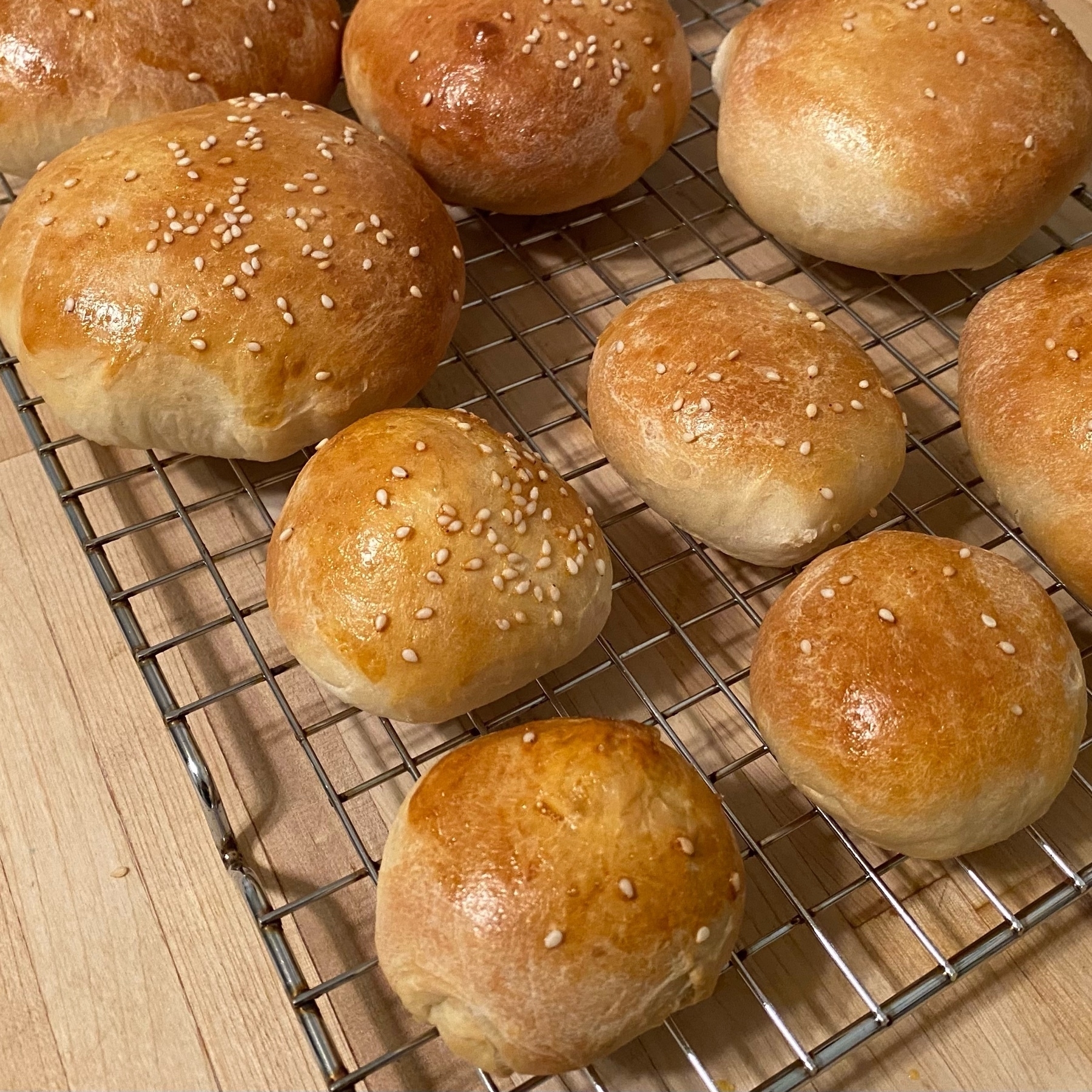Picture of dragon baked buns with 4 much smaller than the other buns.