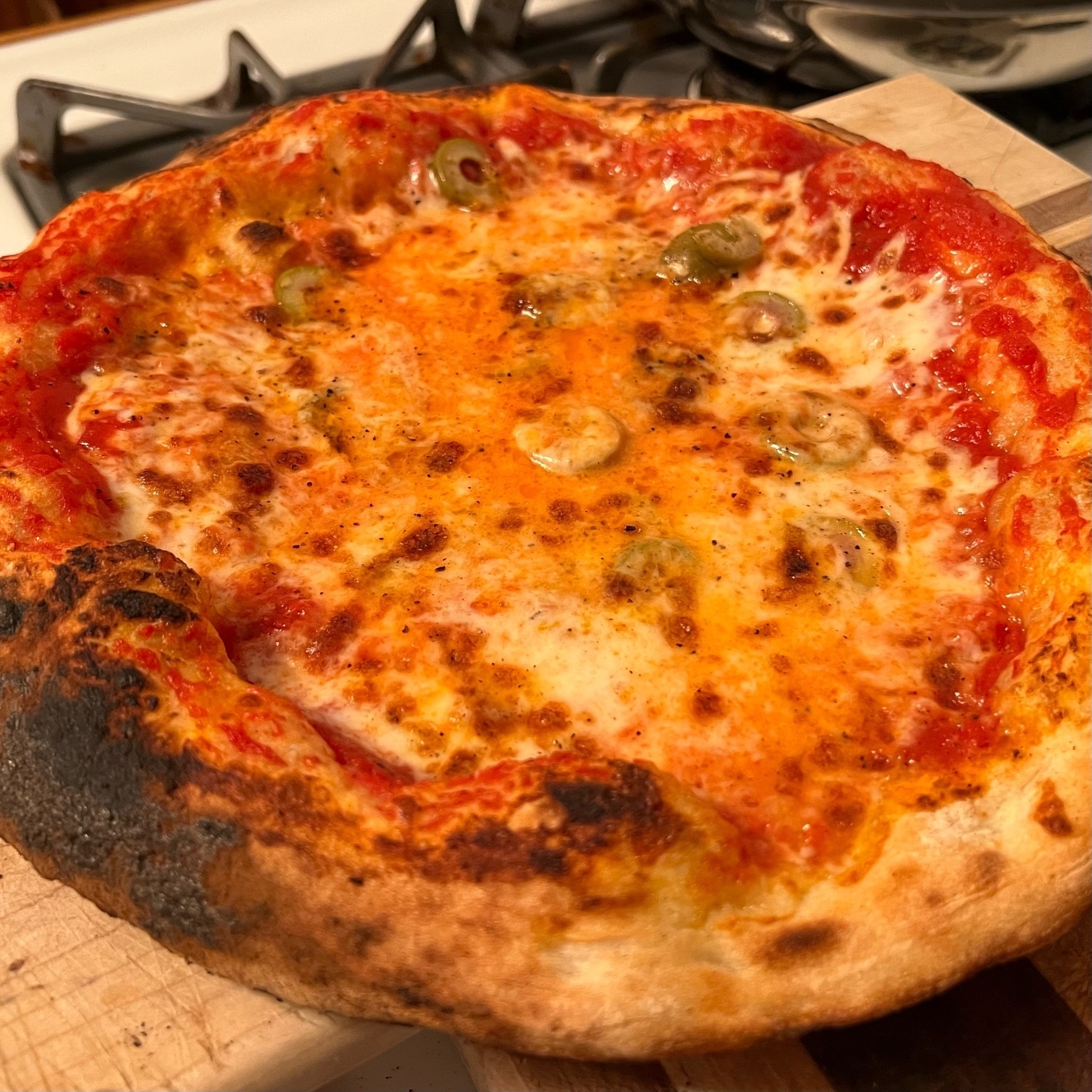Cooked pizza with puffy edges